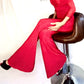 Poly Bardot red jumpsuit with long chiffon sleeves and Swarovski alternative crystal details to one leg